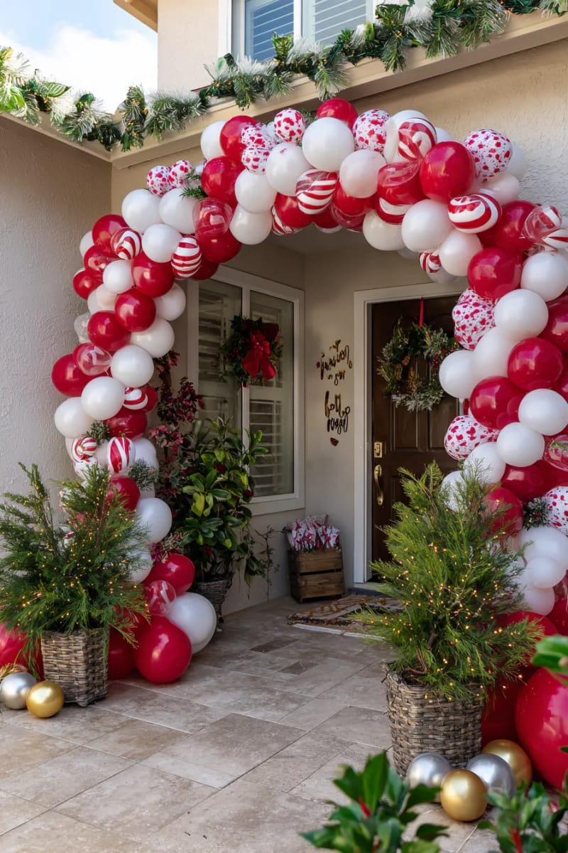 candy cane archway made from twisted red and white balloons for the entry 1