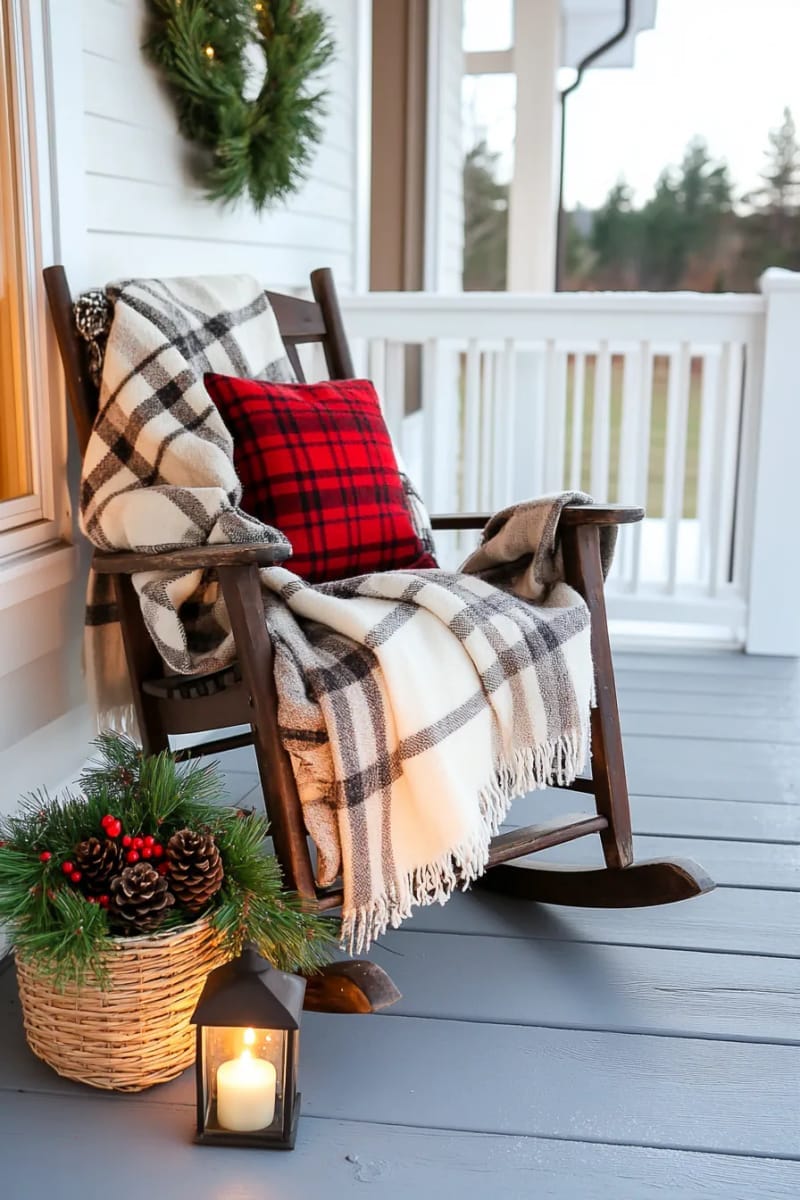 cozy plaid blanket draped over rocking chair with lantern nearby 1