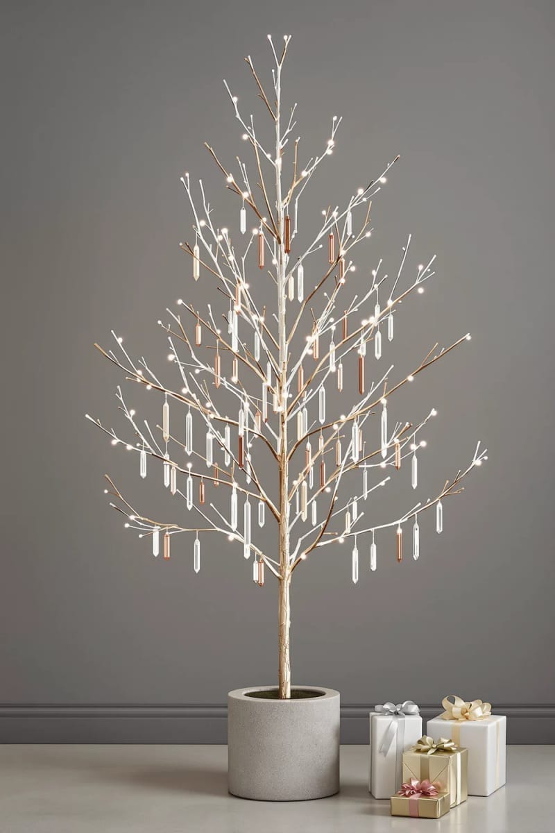 decorate a minimalist tree with only metallic icicle ornaments. 1
