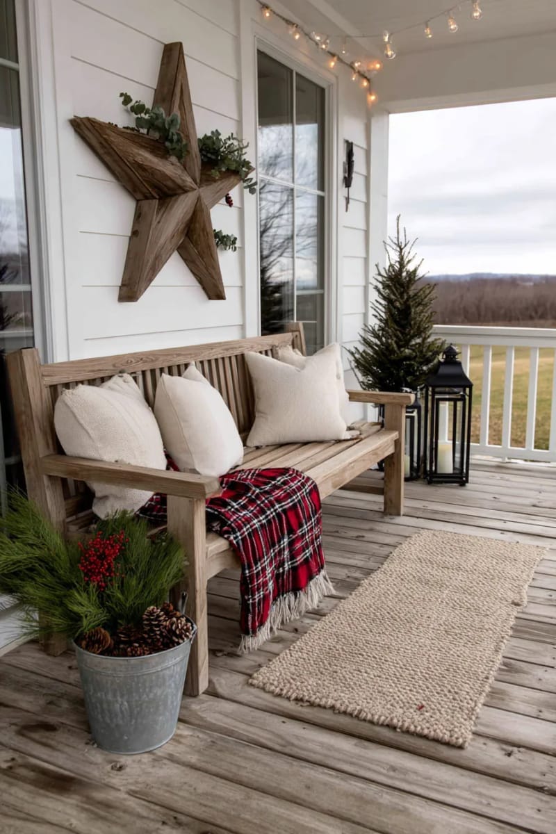 diy wooden star with eucalyptus and berries above the porch bench 1