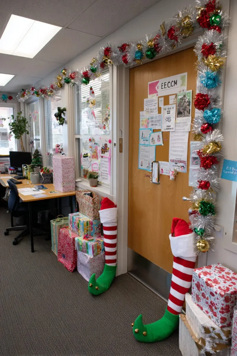 21 Festive Classroom Christmas Decor Ideas for a Joyful Season 92 elf legs and boots sticking out from under the classroom door 1
