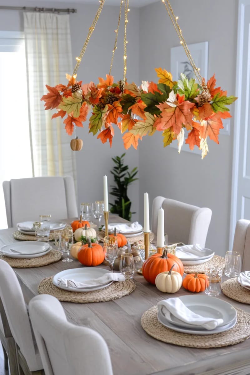 floating leaf garland over the dining table with hanging orange leaves 1