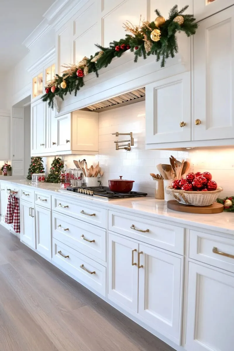 greenery swag with classic red ornaments above cabinet crown molding 1