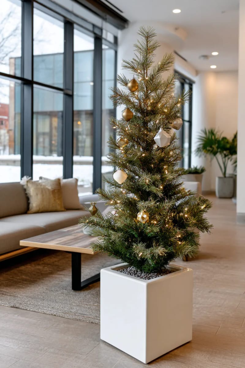 modern minimalist tree with only white fairy lights and geometric ornaments 1