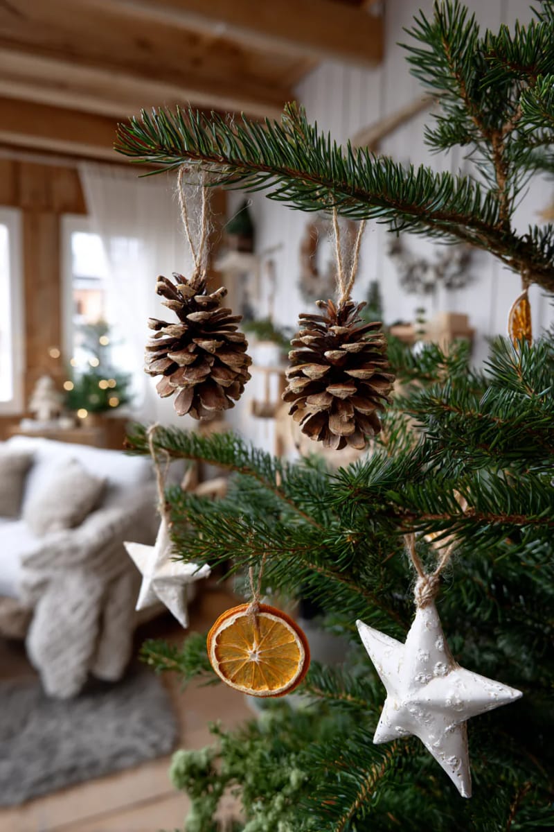 21 Scandinavian Christmas Decorations Ideas To Bring Nordic Charm at Home 41 pinecone and dried orange slice ornaments for a rustic nordic feel 1