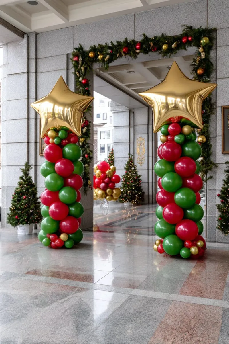 21 Christmas Balloon Decor Ideas for a Fun and Festive Holiday 18 red and green balloon columns topped with golden stars at party entrance 1