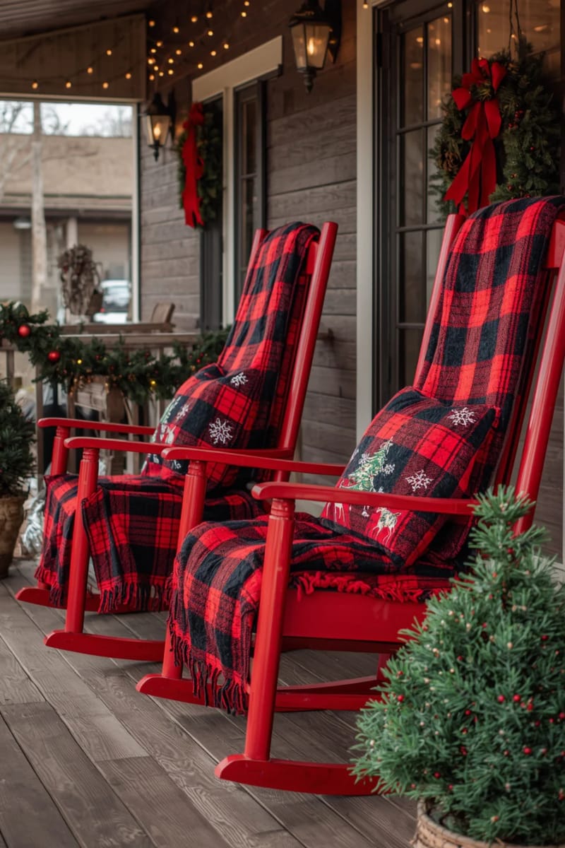 red rocking chairs draped with buffalo plaid blankets and festive pillows 1