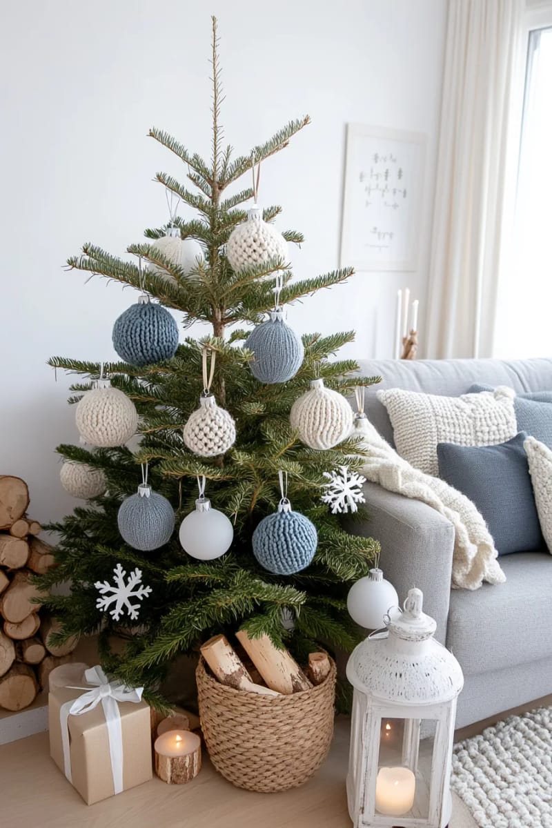 21 Scandinavian Christmas Decorations Ideas To Bring Nordic Charm at Home 36 soft knit baubles in muted blue, gray, and cream on the christmas tree 1