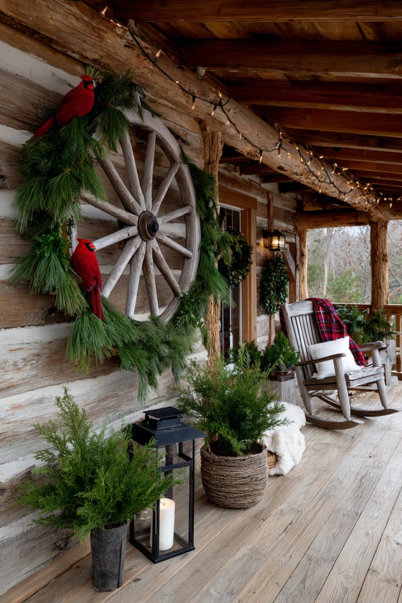 wagon wheel decorated with cedar garlands and cardinal accents 1