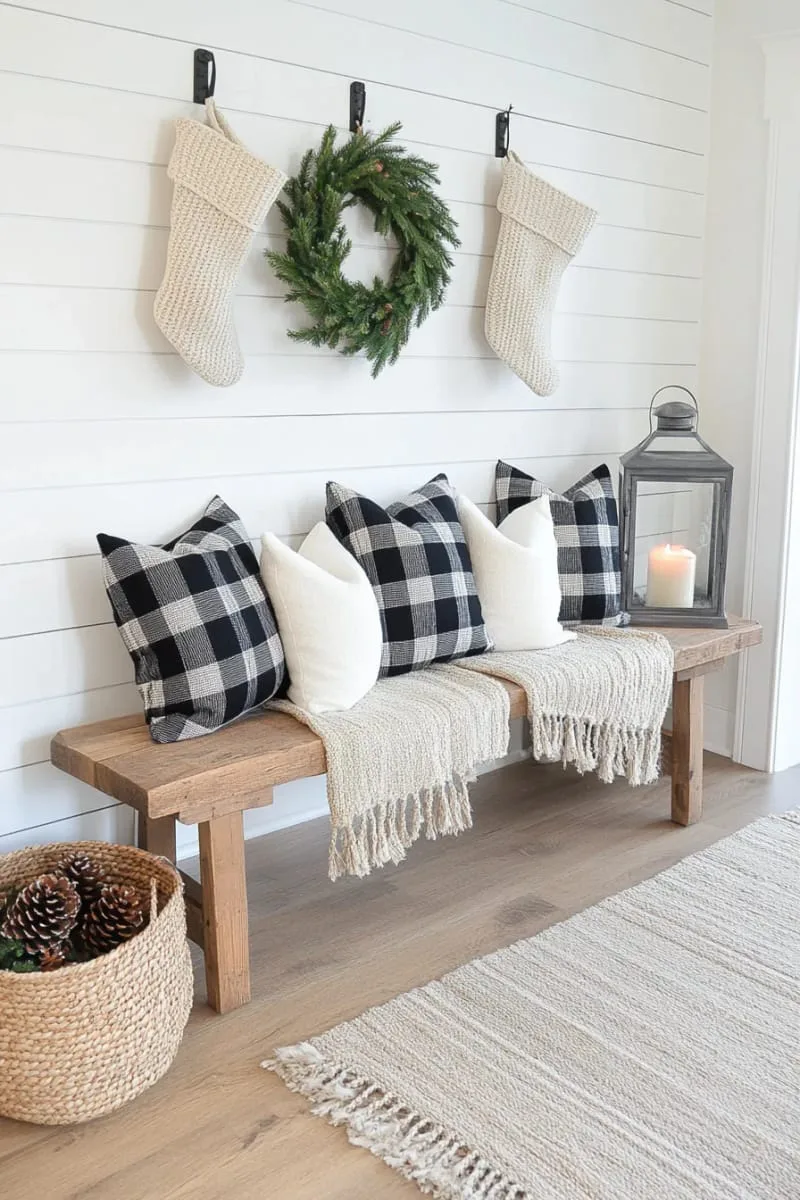 farmhouse entry bench styled with buffalo plaid pillows and knit stockings 1