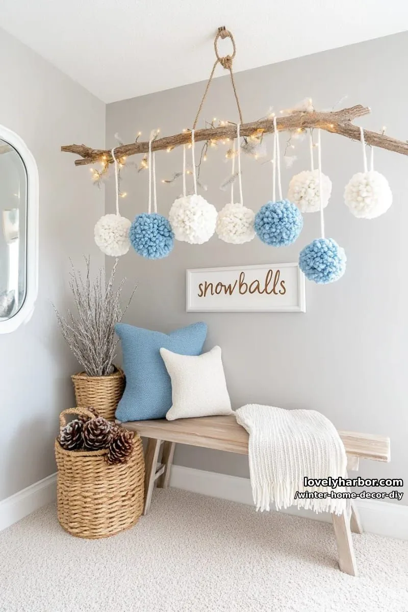 hanging pom-pom “snowball” mobile for whimsical entryway inspiration 1
