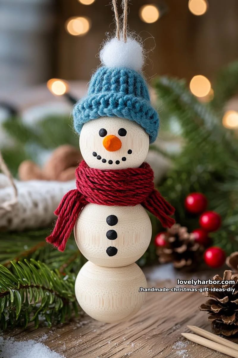 wooden bead snowman ornament with a tiny knitted hat and scarf 1