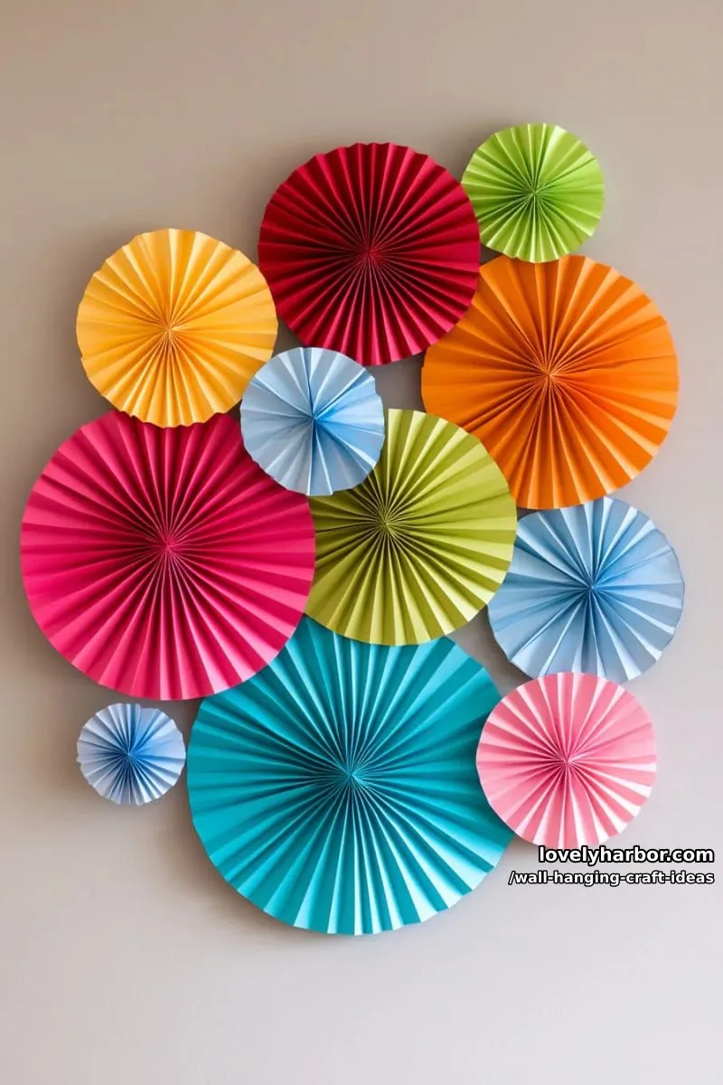 15 Artistic Wall Hanging Crafts to Upgrade Your Home 23 create a mandala-inspired wall hanging using circular paper fans in multiple colors. 1