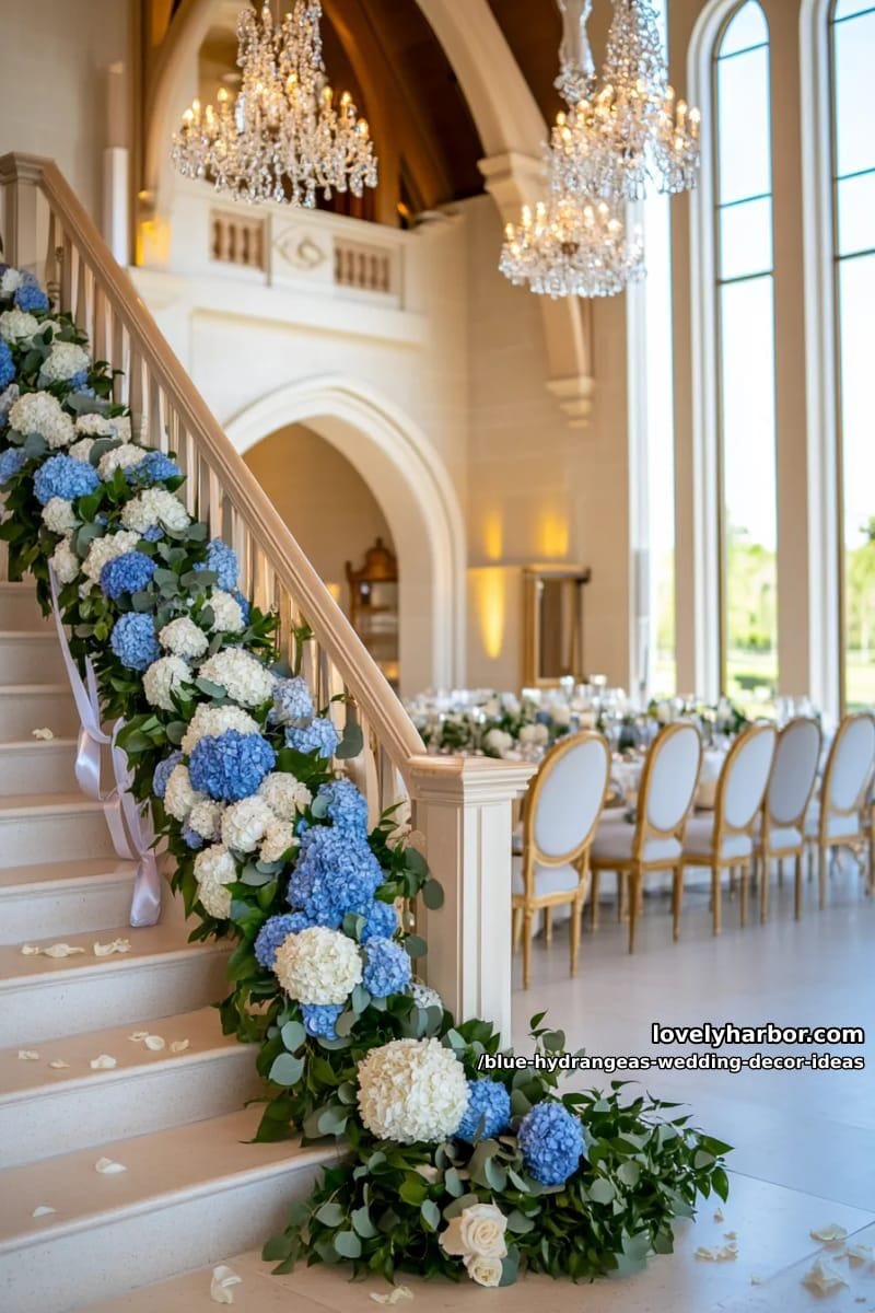blue and ivory hydrangea garland wrapped around staircase railing 1