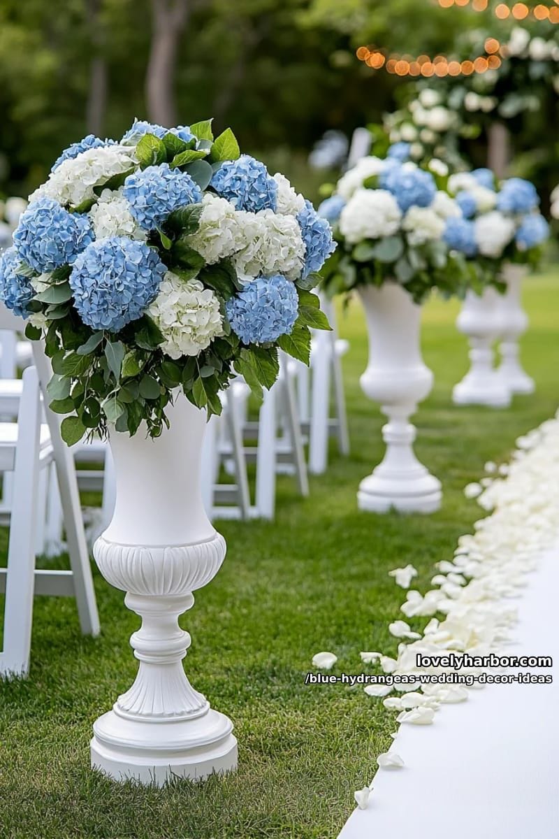 large baby blue hydrangea pomanders lining the outdoor aisle 1