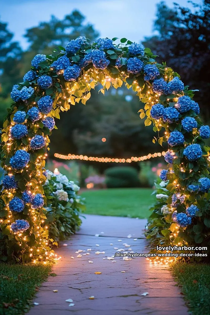 lush hydrangea garden arch with twinkle fairy lights at dusk 1