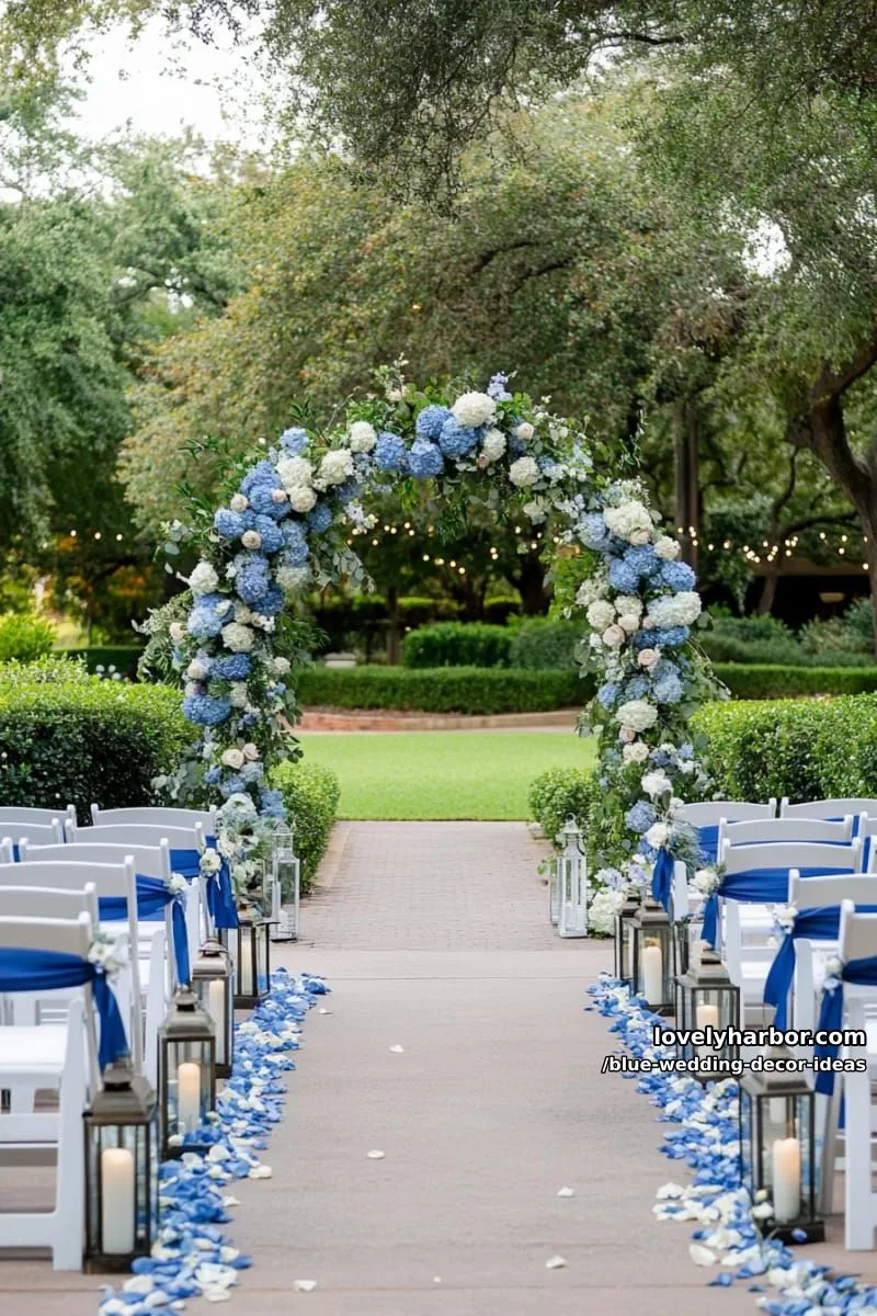 romantic blue floral arch with trailing greenery for outdoor ceremonies 1