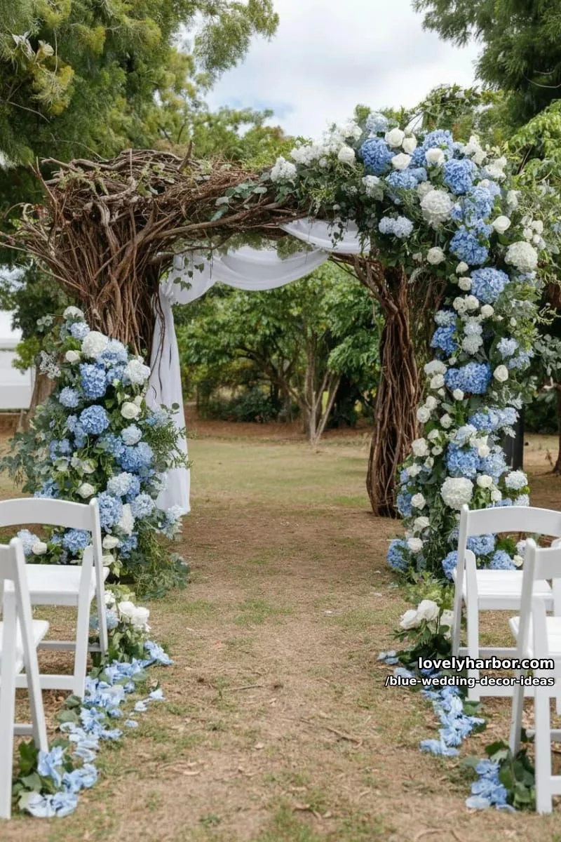 romantic blue floral arch with trailing greenery for outdoor ceremonies 1