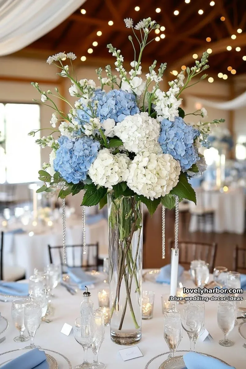 tall glass vases filled with cascading blue and white hydrangeas 1
