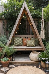 a-frame garden nook with wood bench, patterned cushions, and string lights. 34