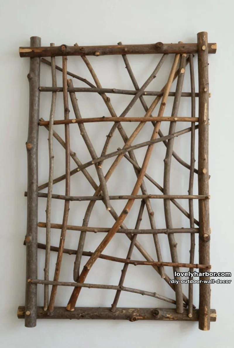 20 Easy DIY Outdoor Wall Decor Ideas You'll Love 27 branch and stick crisscross frame for rustic natural indoor wall art 1