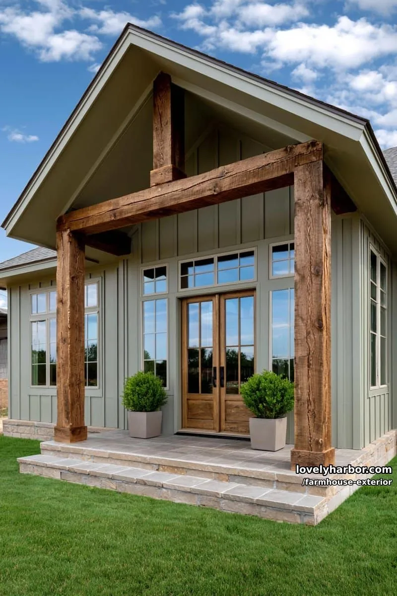 44 New Farmhouse Exterior Designs To Copy 69 light sage green farmhouse, gabled roof, rustic wood posts, symmetrical windows, potted shrubs. 1