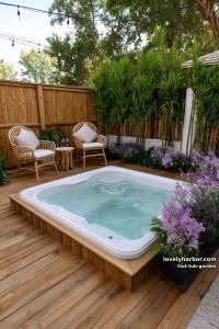 patio hot tub with bamboo, lavender, string lights, and rattan chairs. 24