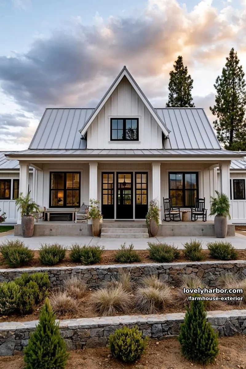 44 New Farmhouse Exterior Designs To Copy 17 symmetrical farmhouse, central dormer, wide porch, tiered landscaping, setting sun. 1