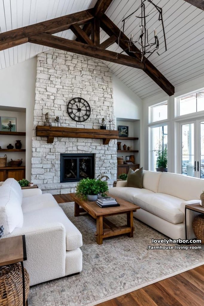 vaulted ceiling living room with white shiplap, stone fireplace, off-white sofas, and metal chandelier. 27