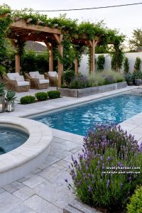 rectangular pool, hot tub, stone patio, pergola, and garden beds. 4