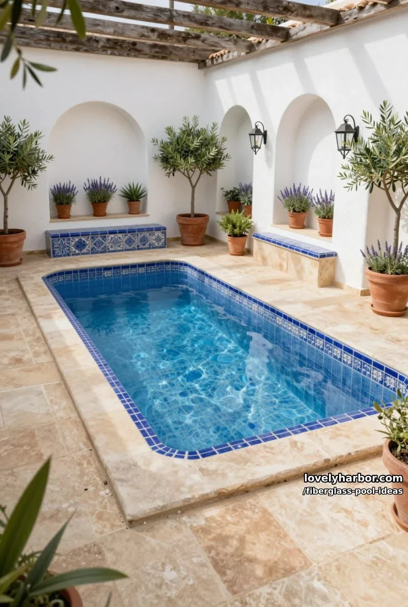 20 Fiberglass Pool Ideas for a Cozy Outdoor Retreat 19 small fiberglass courtyard pool with blue patterned tiles, mediterranean accents, and compact layout. 1