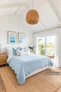 20 Dreamy Blue Coastal Bedrooms for Effortless Relaxation 6 white shiplap coastal bedroom with rattan lighting and beach-themed wall art. 3