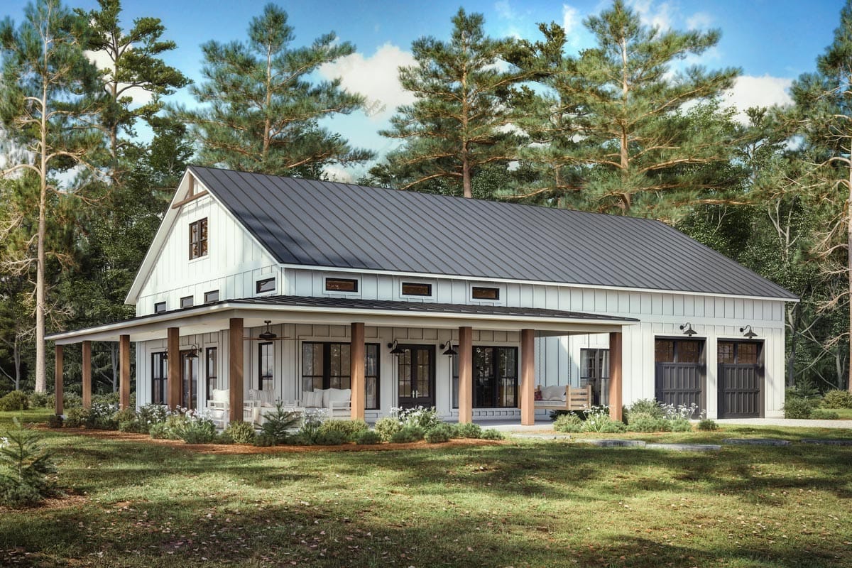 Modern farmhouse with wraparound porch, vertical siding, and metal roof in wooded setting
