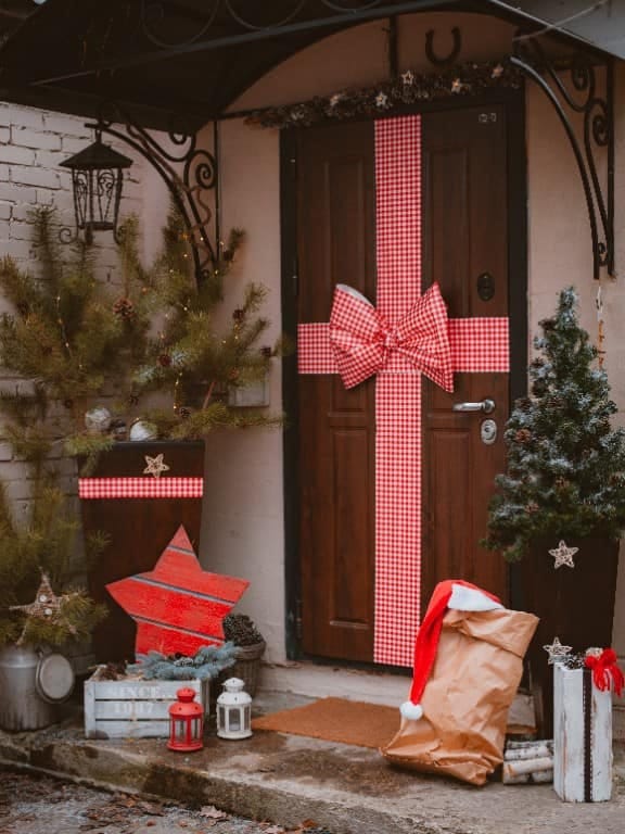 flank the door with giant presents and a nutcracker guard 1