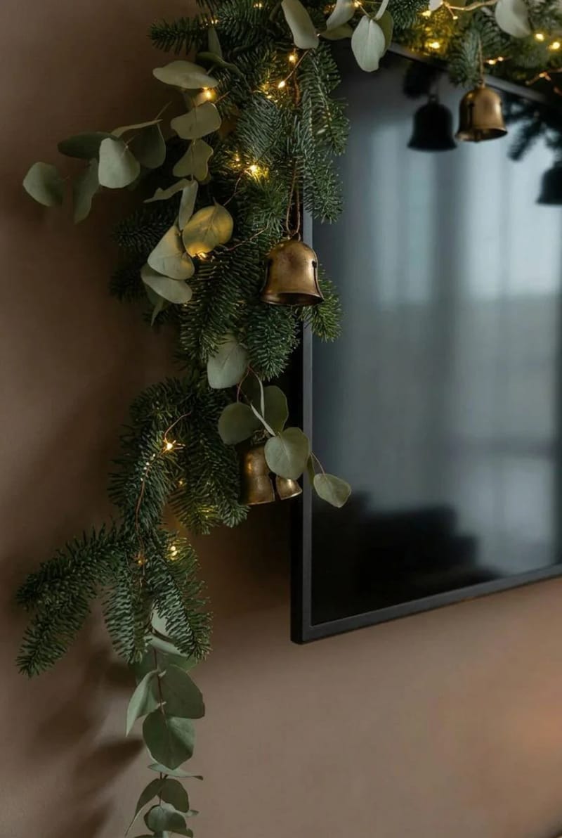 Cozy Christmas Living Room Ideas for Small Spaces, Without the Clutter 11 garland the tv and the shelves when there's no mantel 10