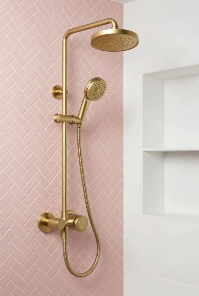 20 Pink Coastal Bathroom Ideas With a Breezy Finish 11 gold dual shower head on pink herringbone tile wall. 1