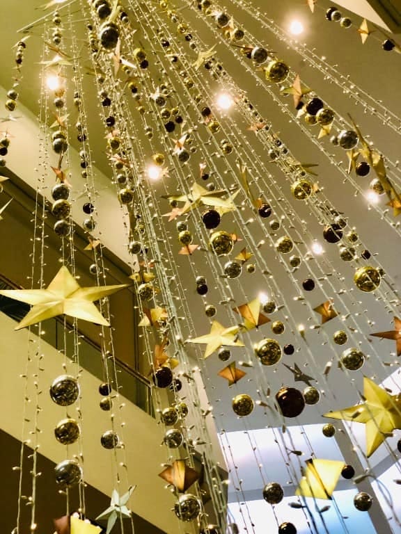 Whoville-Inspired Indoor Christmas Decorations That Skip the Generic Grinch Look 6 hang oversized ornaments from the ceiling, not just the tree 5