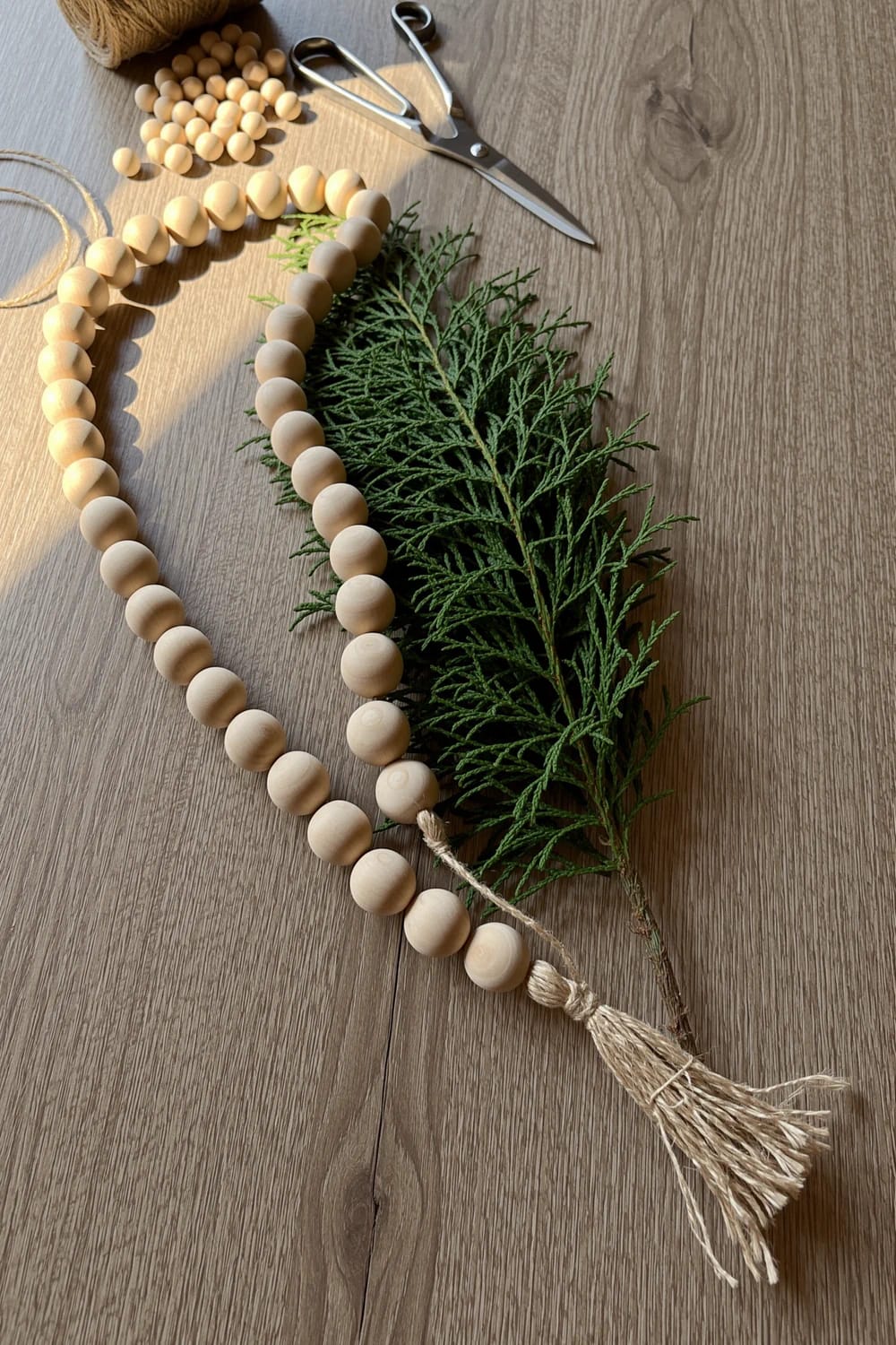 layer a wooden bead garland under the greenery, not on top of it 1