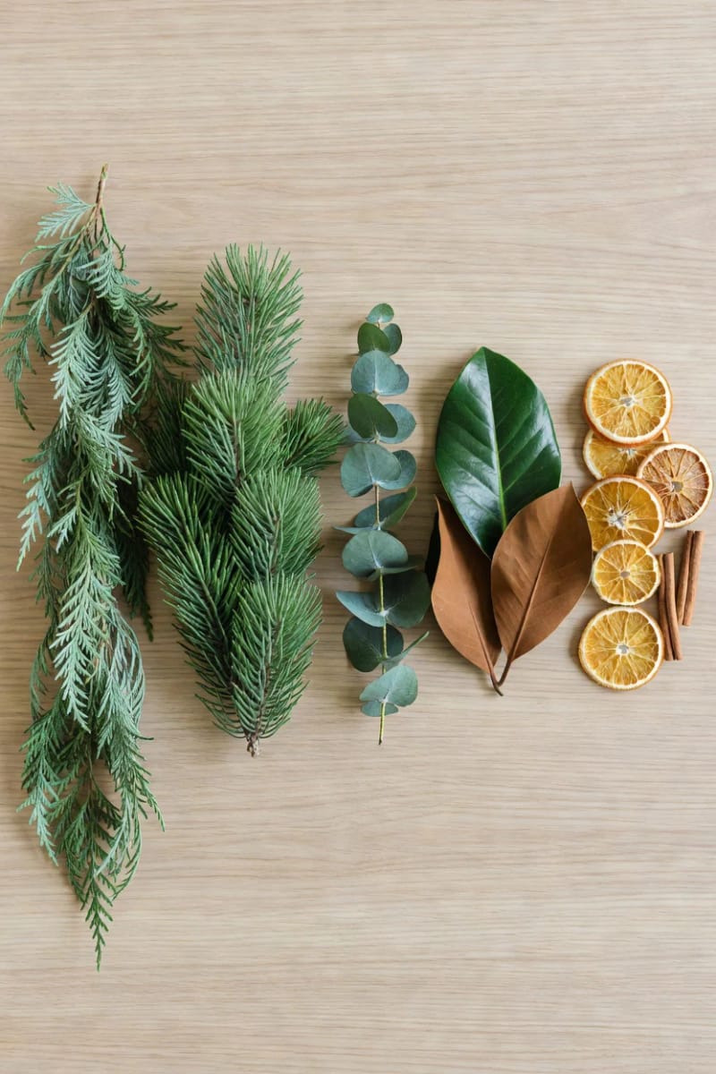Christmas Mantel Decor Ideas With Garland That Look Designer, Not Draped-On 13 mix your mantel greenery: cedar, eucalyptus, magnolia, and dried citrus 12