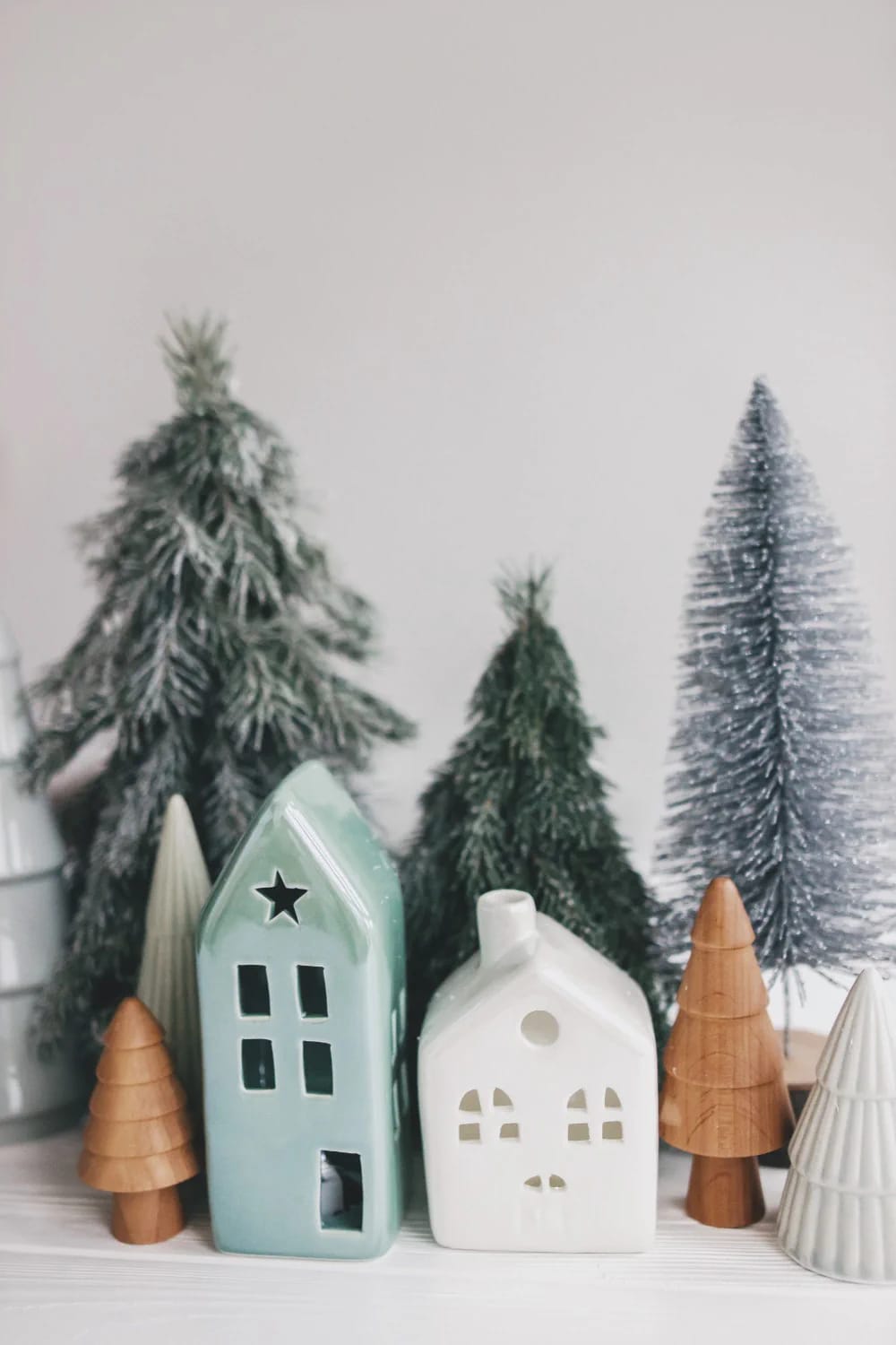 Christmas Decor Ideas Without a Fireplace: Where to Put the Focal Point Instead 19 put the christmas village on a bookshelf and light it from behind 1
