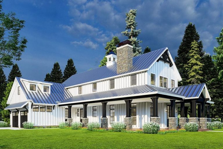 Front view of a 3-bedroom rustic house with a wraparound porch, stone chimney, white board-and-batten siding, and a blue metal roof, set among green lawn and tall trees, illustrating the 3,014 sq. ft. rustic home plan with a two-story great room.