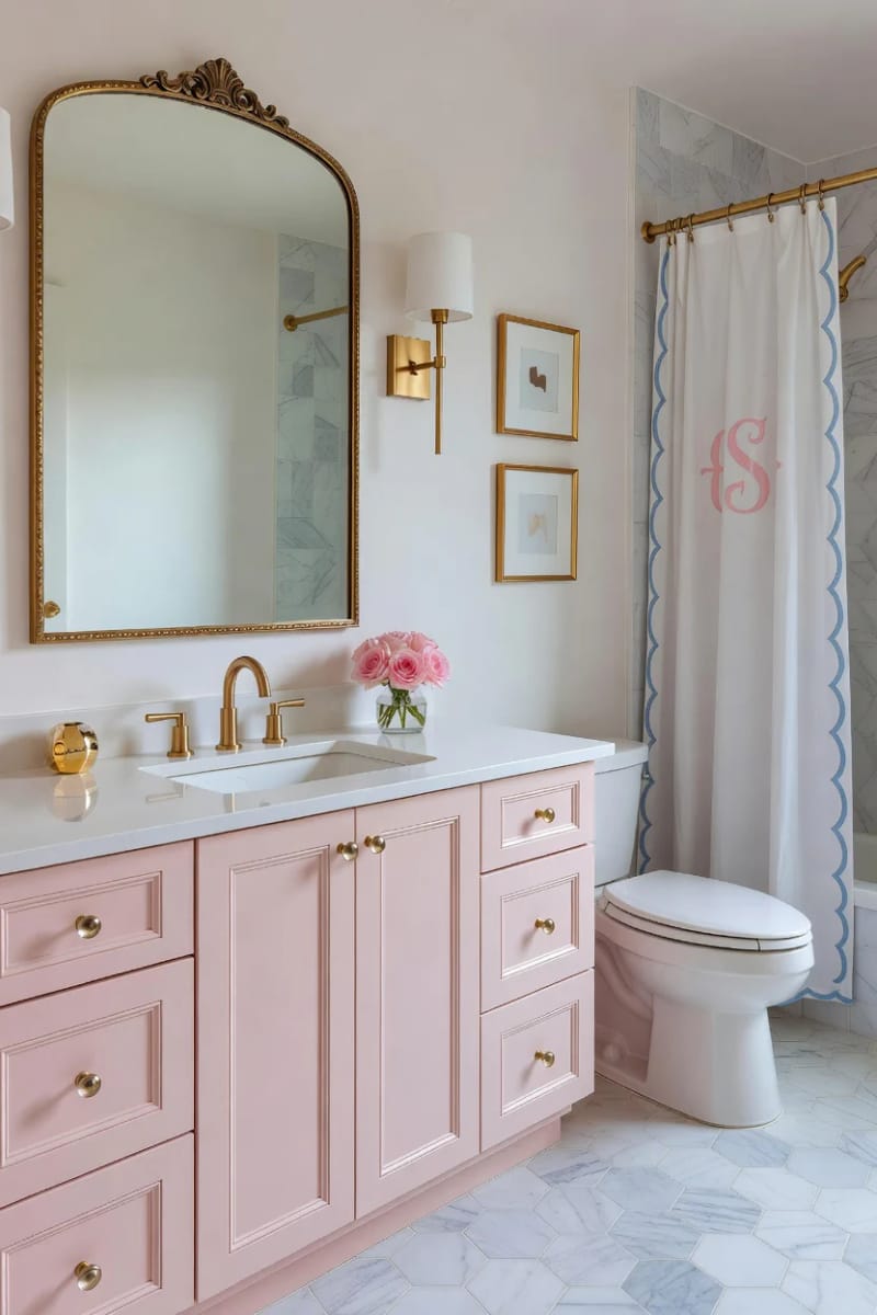 20 Pink Coastal Bathroom Ideas With a Breezy Finish 2 soft pink bathroom with brass accents and marble hexagon tile flooring. 1