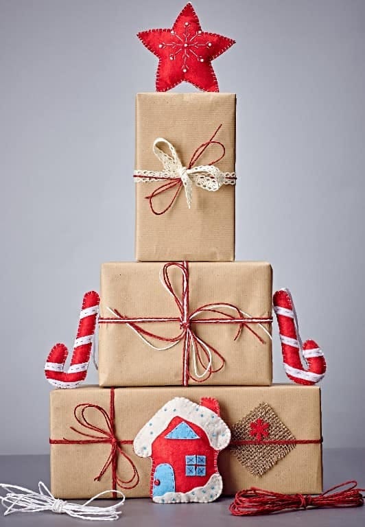 12 Whimsical Christmas Decor Ideas to Run Through the Whole House 13 stack oversized diy presents where a blow-mold would go 1
