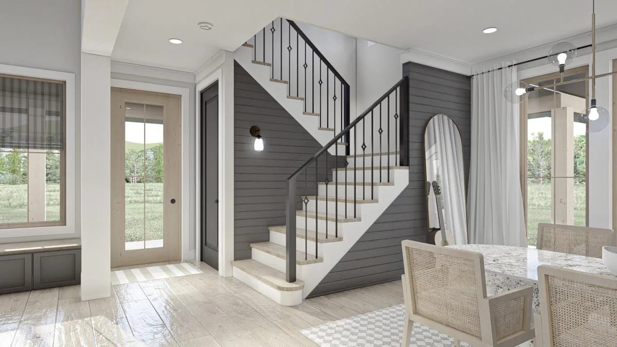 the entry stair wall is dark horizontal shiplap behind black metal railing 1