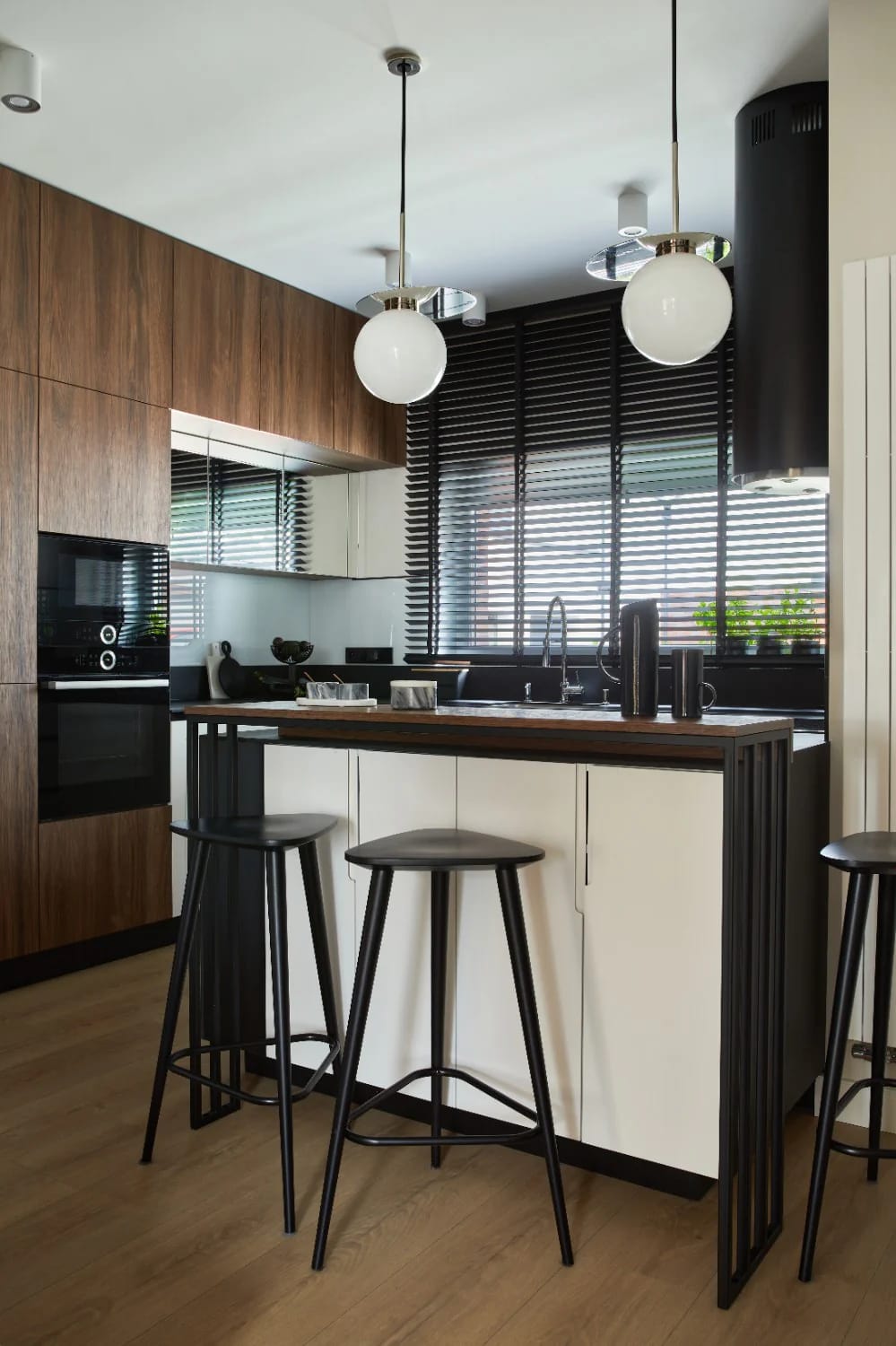 the warm-modern japanese kitchen: island, black steel, garden view 1