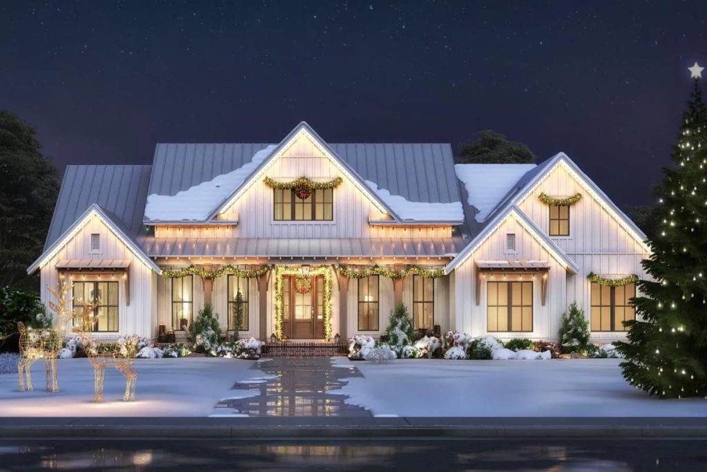 Nighttime exterior render of a white farmhouse with holiday lights, snow, and festive decorations.