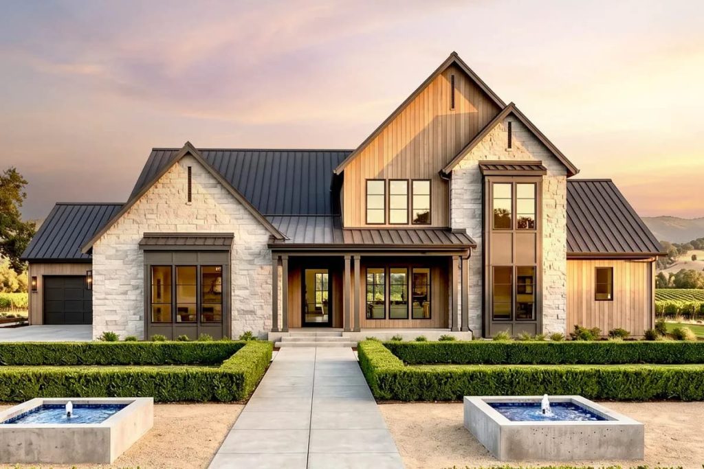 Lovely Harbor 45 Modern farmhouse exterior with stone and wood siding, metal roof, and landscaped entry with fountains