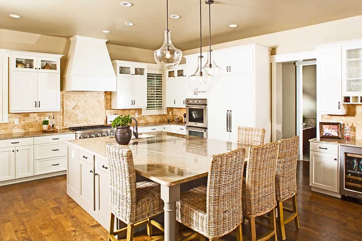 a 9-by-7 kitchen island under glass globes 1