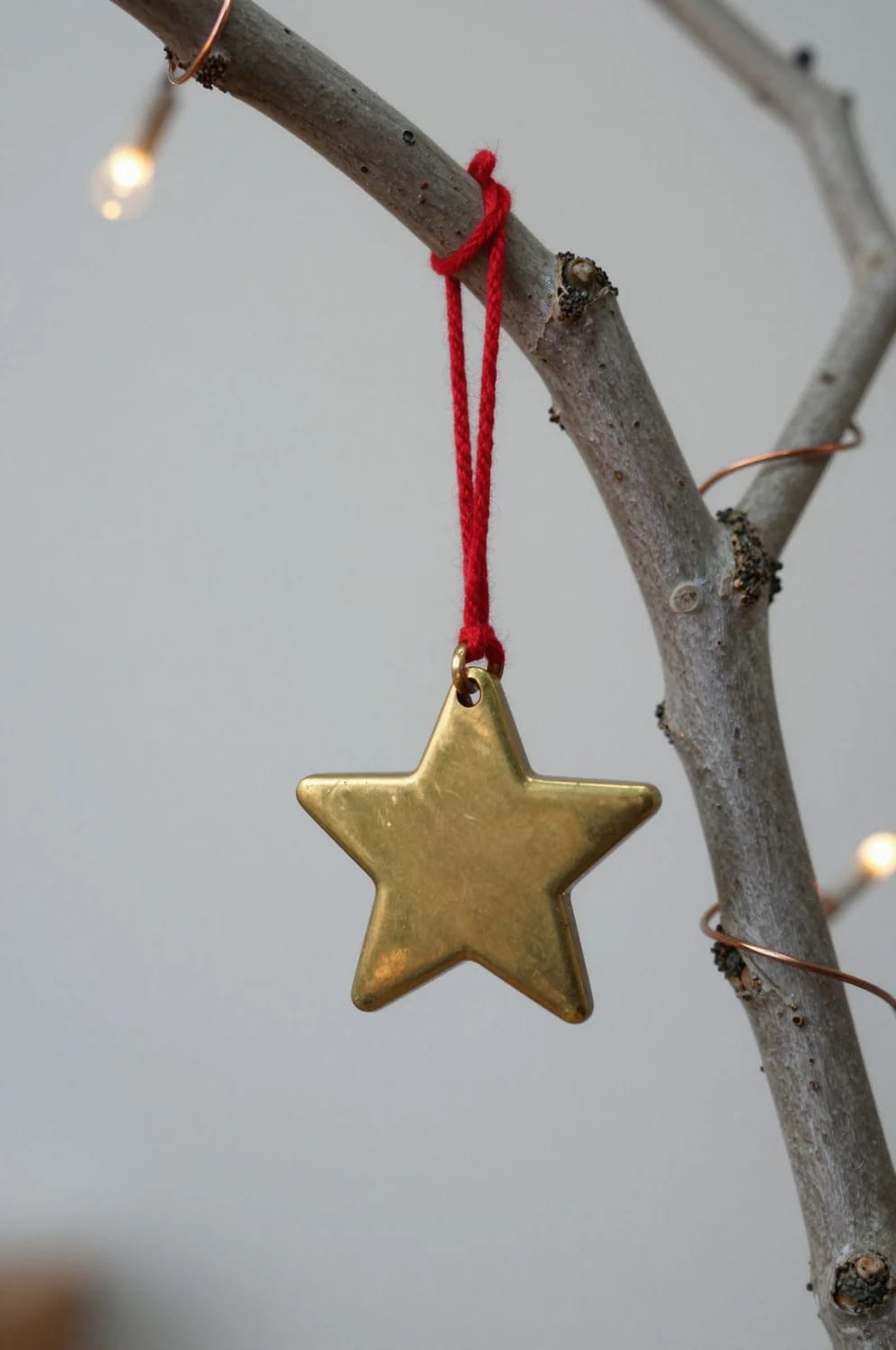 Small Apartment Christmas Tree Ideas for a Slim or Tabletop Tree That Doesn't Look Like a Compromise 22 a bare branch tree for the studio where green is too loud 1