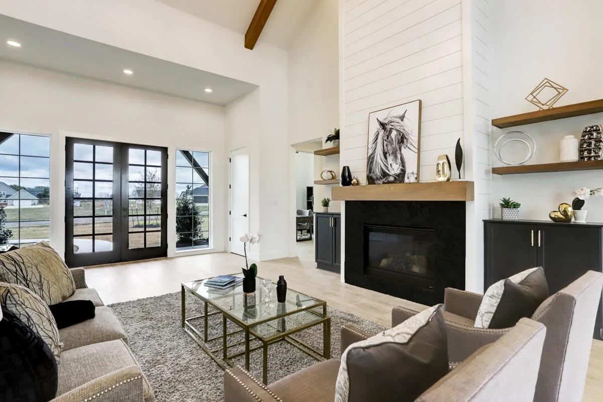 4-Bedroom Modern Farmhouse House Plan with a Vaulted Great Room and Bonus Room (2,877 Sq. Ft. Floor Plan) 6 a shiplap chimney breast straight up the great room vault 1
